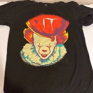 Authentic IT shirt, never been worn! Excellent. Adult small